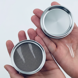 Silver chrome grinder with mesh screen and components